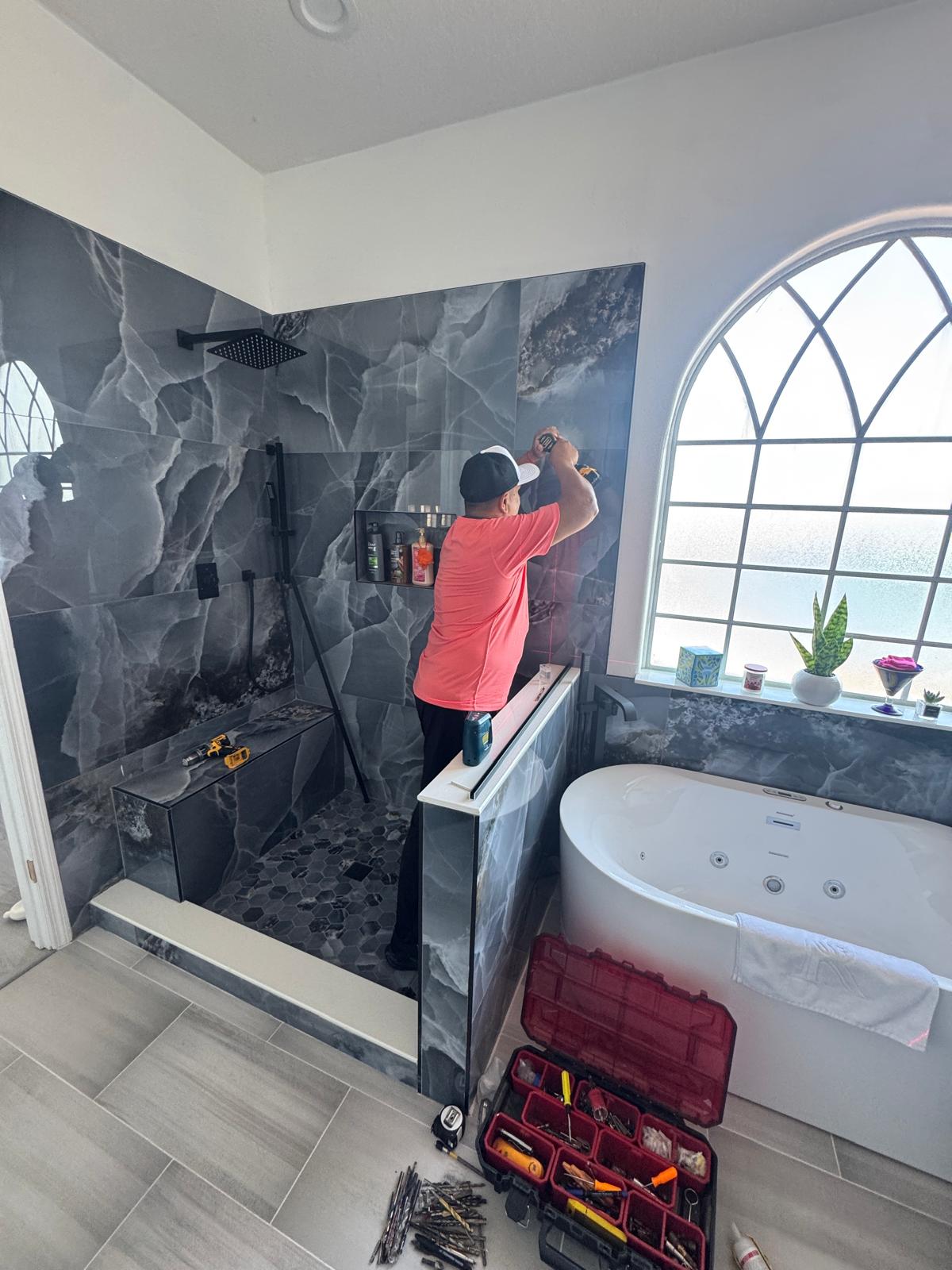 Large format tile wall installation in Orlando bathroom remodel